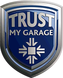 A blue and silver shield-shaped logo with the words "TRUST MY GARAGE" in bold letters signifies reliability. Below the text, a white geometric design echoes arrows pointing outward, symbolizing expertise in car servicing and garage mechanic services.